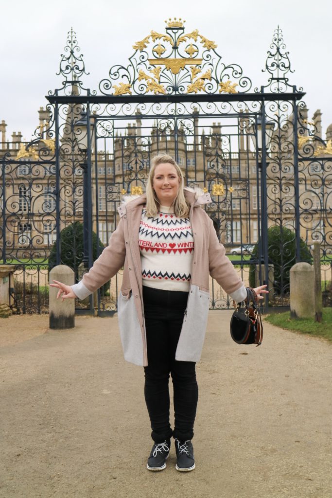lucy in front of burghley house gates
