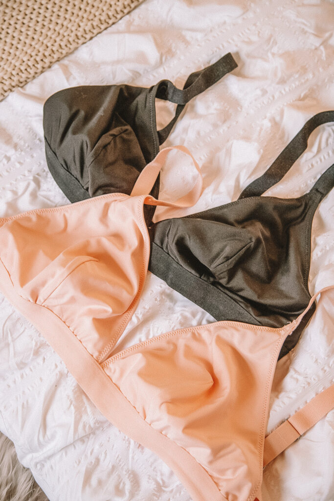 two of the three bras in peach and black 
