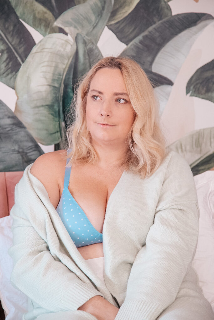 lucy in a light blue bra with cardigan 