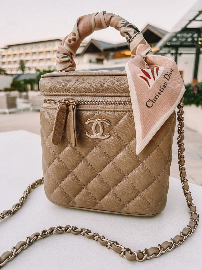 Lucy’s Chanel beige vanity bag on a table