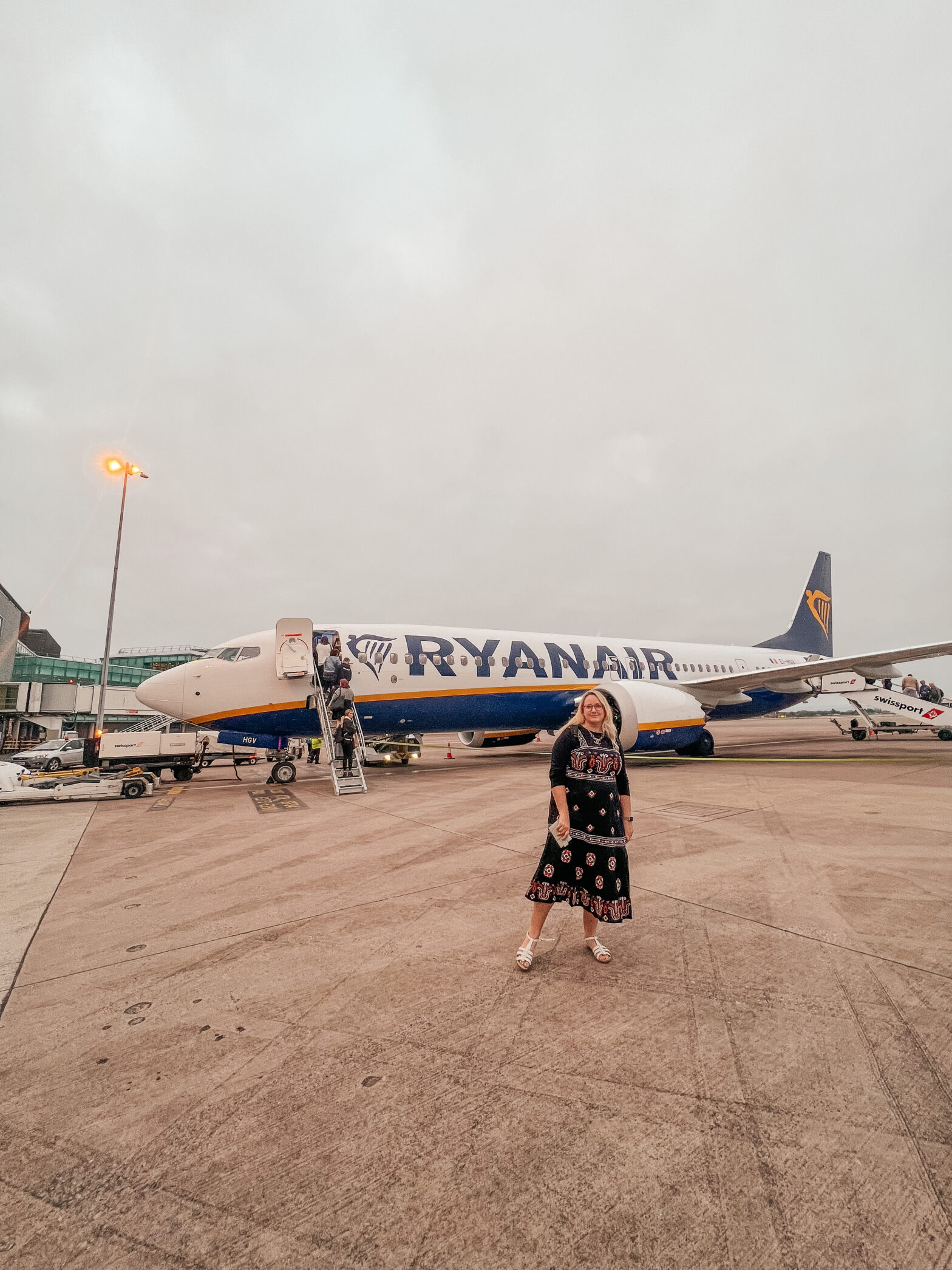 Lucy standing in front of a Ryanair plane
