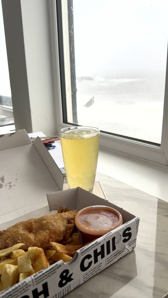 fish, chips beans and an orange squash with a view 