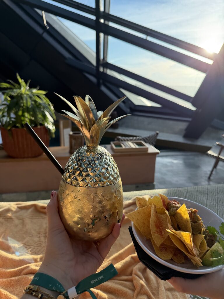 the pineapple sharing cocktail and food 