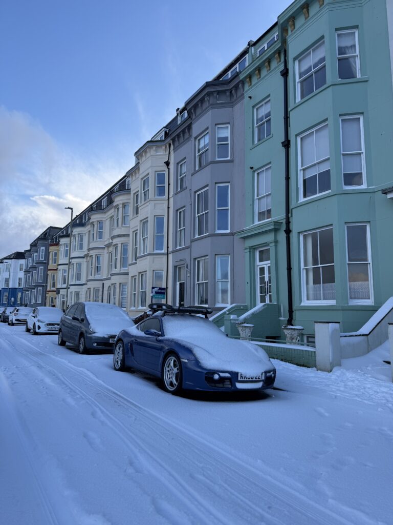 the row of colourful houses which housed some of the apartments and snow on the ground